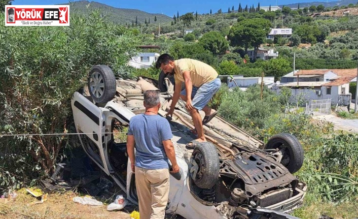 Söke’de virajı alamayan araç takla attı