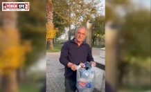 Şehitliğe saygısızlık yapanlara tepki gösterdi, çöpleri tek tek topladı